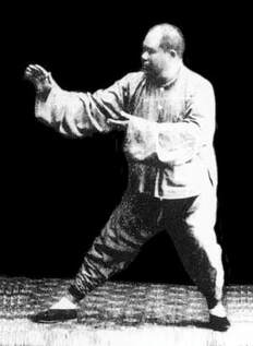 Photo: Yang Cheng Fu in pull down move of Grasp Swallow's Tai sequence in Tai Chi. ©