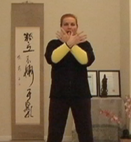 Photo: Cross hands Qi Gong posture. © All rights reserved.